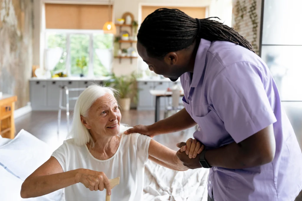 home care aide assisting elderly woman at home with compassion