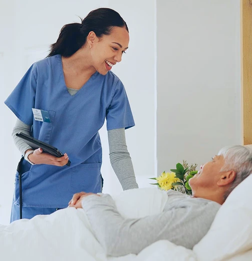A professional home care worker looks after an elderly woman.