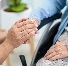 A professional home care worker looks after an elderly woman.