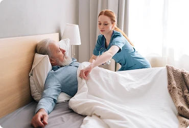 A professional home care worker looks after an elderly woman