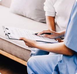 A professional home care worker looks after an elderly woman