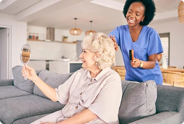 A professional home care worker looks after an elderly woman