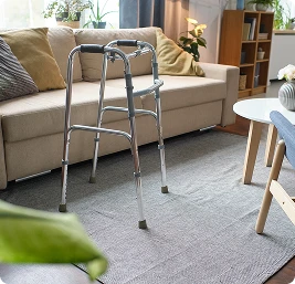 Walker positioned in living room as mobility support equipment for seniors, interior detail